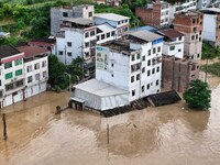 Aerial photo is showing houses and fields along the Wuyang River's Cenggong and Zhenyuan Yangping sections being flooded in Qiandongnan Pref...