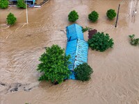 Aerial photo is showing houses and fields along the Wuyang River's Cenggong and Zhenyuan Yangping sections being flooded in Qiandongnan Pref...