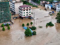 Aerial photo is showing houses and fields along the Wuyang River's Cenggong and Zhenyuan Yangping sections being flooded in Qiandongnan Pref...