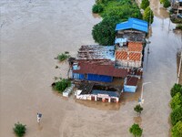 Aerial photo is showing houses and fields along the Wuyang River's Cenggong and Zhenyuan Yangping sections being flooded in Qiandongnan Pref...