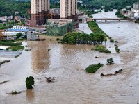 Aerial photo is showing houses and fields along the Wuyang River's Cenggong and Zhenyuan Yangping sections being flooded in Qiandongnan Pref...