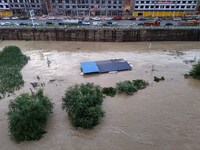 Aerial photo is showing houses and fields along the Wuyang River's Cenggong and Zhenyuan Yangping sections being flooded in Qiandongnan Pref...