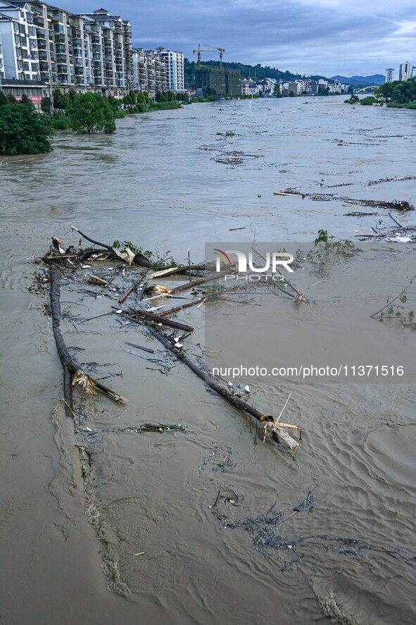 Aerial photo is showing houses and fields along the Wuyang River's Cenggong and Zhenyuan Yangping sections being flooded in Qiandongnan Pref...