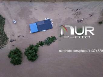 Aerial photo is showing houses and fields along the Wuyang River's Cenggong and Zhenyuan Yangping sections being flooded in Qiandongnan Pref...