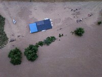 Aerial photo is showing houses and fields along the Wuyang River's Cenggong and Zhenyuan Yangping sections being flooded in Qiandongnan Pref...