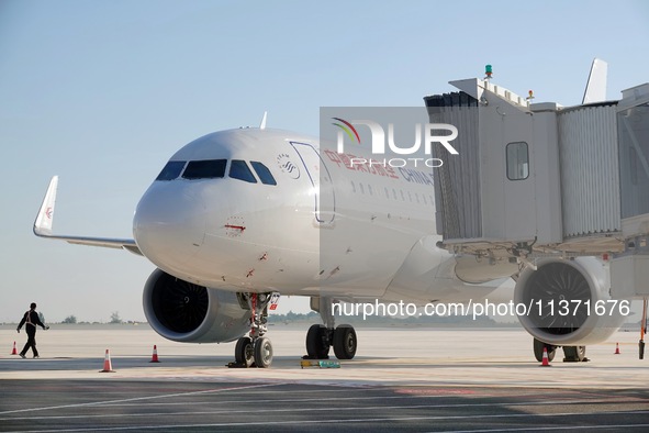 Ground staff are making preparations for a China Eastern Airlines A320 at Yantai Penglai International Airport in Yantai, China, on June 28,...