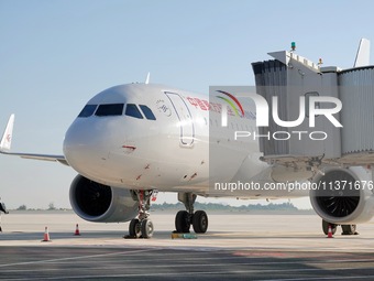 Ground staff are making preparations for a China Eastern Airlines A320 at Yantai Penglai International Airport in Yantai, China, on June 28,...