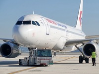 Ground staff are making preparations for a China Eastern Airlines A320 at Yantai Penglai International Airport in Yantai, China, on June 28,...