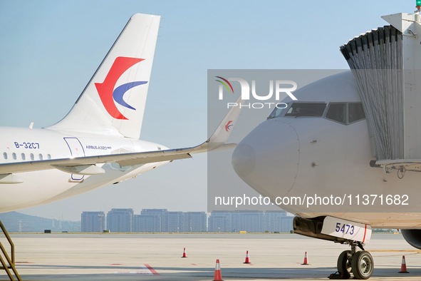 A China Eastern passenger jet is being seen on the tarmac at Yantai Penglai International Airport in Yantai, China, on June 28, 2024. 