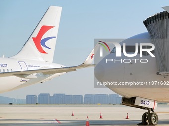 A China Eastern passenger jet is being seen on the tarmac at Yantai Penglai International Airport in Yantai, China, on June 28, 2024. (