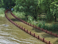 A flooded walkway is being seen after the Yangtze River is exceeding its warning level in Nanjing, Jiangsu province, China, on June 30, 2024...