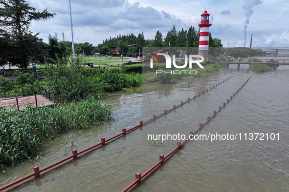 A flooded walkway is being seen after the Yangtze River is exceeding its warning level in Nanjing, Jiangsu province, China, on June 30, 2024...