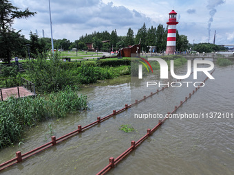 A flooded walkway is being seen after the Yangtze River is exceeding its warning level in Nanjing, Jiangsu province, China, on June 30, 2024...