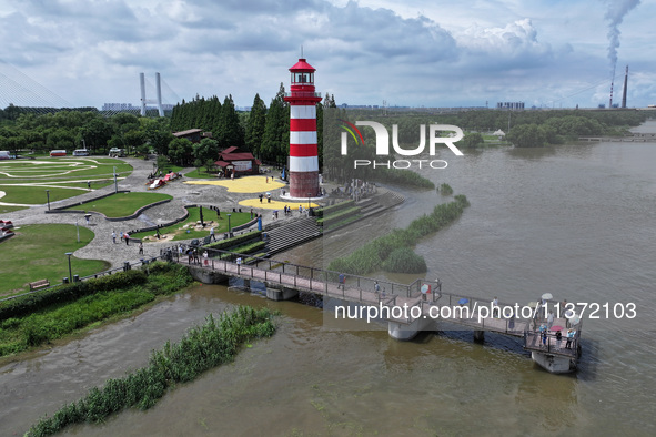 A flooded walkway is being seen after the Yangtze River is exceeding its warning level in Nanjing, Jiangsu province, China, on June 30, 2024...