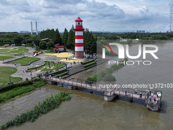 A flooded walkway is being seen after the Yangtze River is exceeding its warning level in Nanjing, Jiangsu province, China, on June 30, 2024...