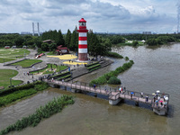 A flooded walkway is being seen after the Yangtze River is exceeding its warning level in Nanjing, Jiangsu province, China, on June 30, 2024...