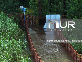 A flooded walkway is being seen after the Yangtze River is exceeding its warning level in Nanjing, Jiangsu province, China, on June 30, 2024...