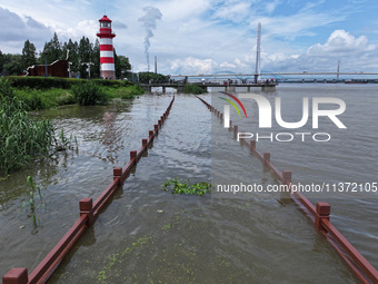 A flooded walkway is being seen after the Yangtze River is exceeding its warning level in Nanjing, Jiangsu province, China, on June 30, 2024...