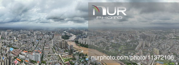 A photo is showing the construction site near Baotong Bridge of Shajing Qinjiang Bridge in Qinzhou, China, on June 29, 2024. 