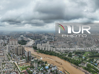 A photo is showing the construction site near Baotong Bridge of Shajing Qinjiang Bridge in Qinzhou, China, on June 29, 2024. (