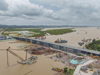 A photo is showing the construction site near Baotong Bridge of Shajing Qinjiang Bridge in Qinzhou, China, on June 29, 2024. (