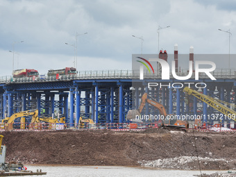 A photo is showing the construction site near Baotong Bridge of Shajing Qinjiang Bridge in Qinzhou, China, on June 29, 2024. (