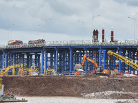 A photo is showing the construction site near Baotong Bridge of Shajing Qinjiang Bridge in Qinzhou, China, on June 29, 2024. (