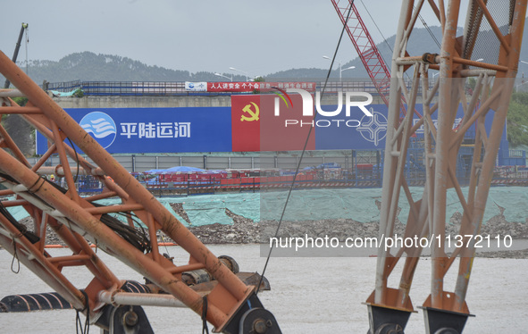 A photo is showing the construction site near Baotong Bridge of Shajing Qinjiang Bridge in Qinzhou, China, on June 29, 2024. 