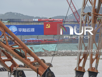 A photo is showing the construction site near Baotong Bridge of Shajing Qinjiang Bridge in Qinzhou, China, on June 29, 2024. (