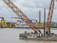 A large cutter suction dredger is under construction near the Qinjiang River Bridge at the mouth of the Qinjiang River in Qinzhou, China, on...