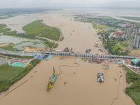 A large cutter suction dredger is under construction near the Qinjiang River Bridge at the mouth of the Qinjiang River in Qinzhou, China, on...