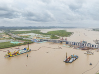 A large cutter suction dredger is under construction near the Qinjiang River Bridge at the mouth of the Qinjiang River in Qinzhou, China, on...