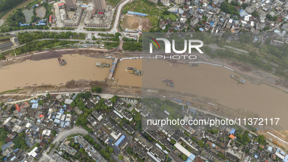 A photo is showing the construction site near Baotong Bridge of Shajing Qinjiang Bridge in Qinzhou, China, on June 29, 2024. 