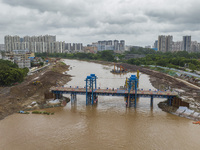 A photo is showing the construction site near Baotong Bridge of Shajing Qinjiang Bridge in Qinzhou, China, on June 29, 2024. (