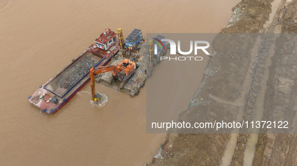 A photo is showing the construction site near Baotong Bridge of Shajing Qinjiang Bridge in Qinzhou, China, on June 29, 2024. 