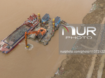 A photo is showing the construction site near Baotong Bridge of Shajing Qinjiang Bridge in Qinzhou, China, on June 29, 2024. (