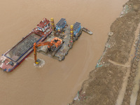 A photo is showing the construction site near Baotong Bridge of Shajing Qinjiang Bridge in Qinzhou, China, on June 29, 2024. (