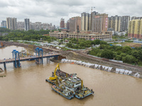 A photo is showing the construction site near Baotong Bridge of Shajing Qinjiang Bridge in Qinzhou, China, on June 29, 2024. (