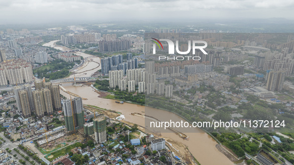 A photo is showing the construction site near Baotong Bridge of Shajing Qinjiang Bridge in Qinzhou, China, on June 29, 2024. 