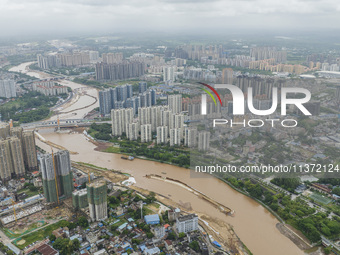 A photo is showing the construction site near Baotong Bridge of Shajing Qinjiang Bridge in Qinzhou, China, on June 29, 2024. (