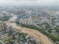 A photo is showing the construction site near Baotong Bridge of Shajing Qinjiang Bridge in Qinzhou, China, on June 29, 2024. (