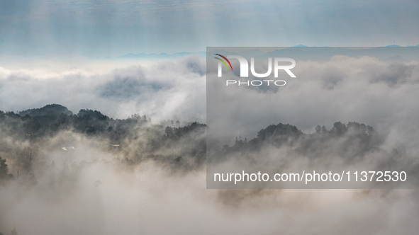 Advection fog is being seen in a mountain village in Chongqing, China, on June 30, 2024. 