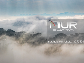 Advection fog is being seen in a mountain village in Chongqing, China, on June 30, 2024. (