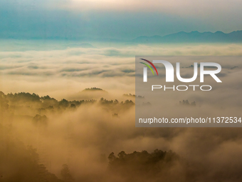 Advection fog is being seen in a mountain village in Chongqing, China, on June 30, 2024. (