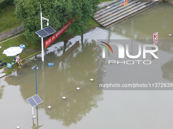 The water level of the Yangtze River is rising above the warning line in Nanjing, China, on June 30, 2024. (