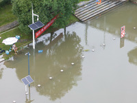 The water level of the Yangtze River is rising above the warning line in Nanjing, China, on June 30, 2024. (