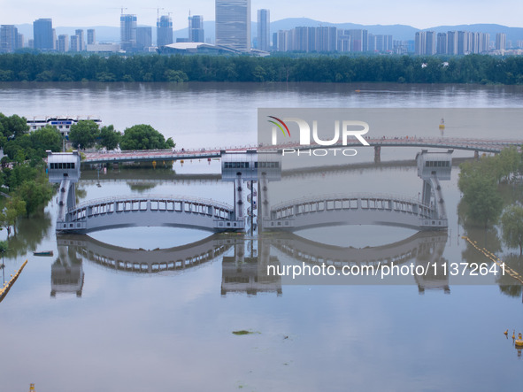 The water level of the Yangtze River is rising above the warning line in Nanjing, China, on June 30, 2024. 