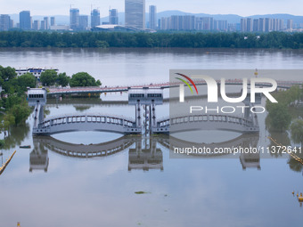 The water level of the Yangtze River is rising above the warning line in Nanjing, China, on June 30, 2024. (