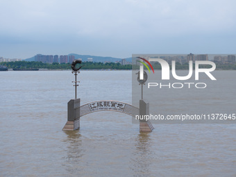 The water level of the Yangtze River is rising above the warning line in Nanjing, China, on June 30, 2024. (