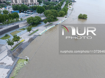 The water level of the Yangtze River is rising above the warning line in Nanjing, China, on June 30, 2024. (